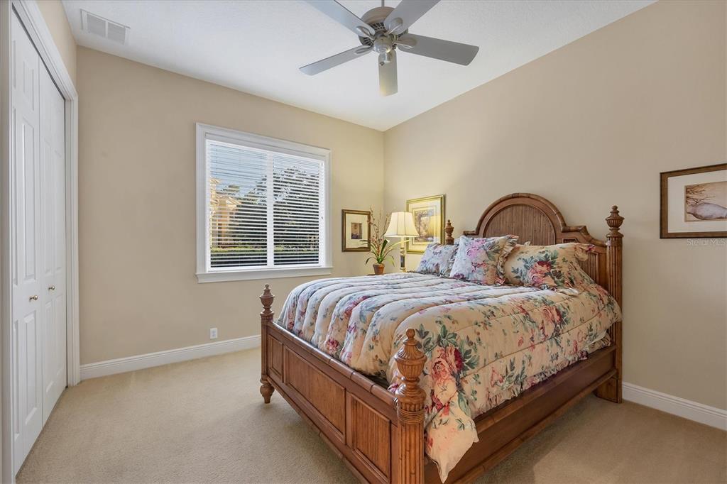 7815 Mathern Court Lakewood Ranch, FL 34202 - Photo 35 of 55 a bed sitting in a bedroom next to a window