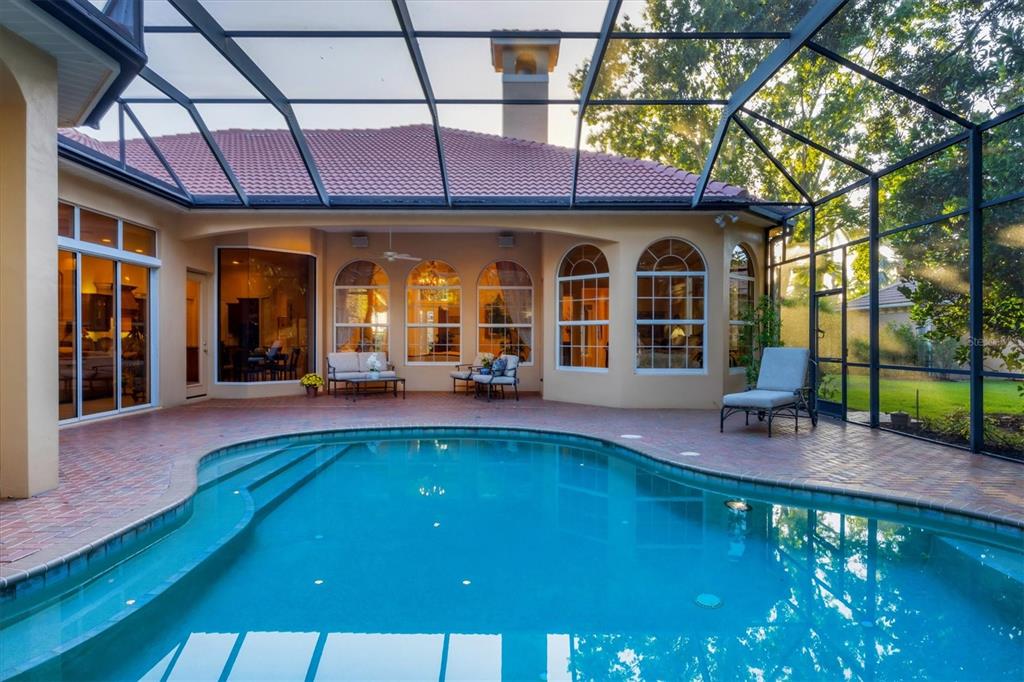 7815 Mathern Court Lakewood Ranch, FL 34202 - Photo 39 of 55 a view of a swimming pool with a patio