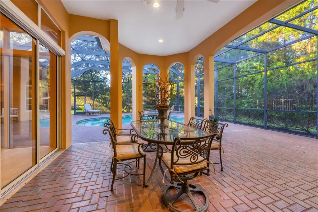 7815 Mathern Court Lakewood Ranch, FL 34202 - Photo 42 of 55 a view of a patio with a table and chairs