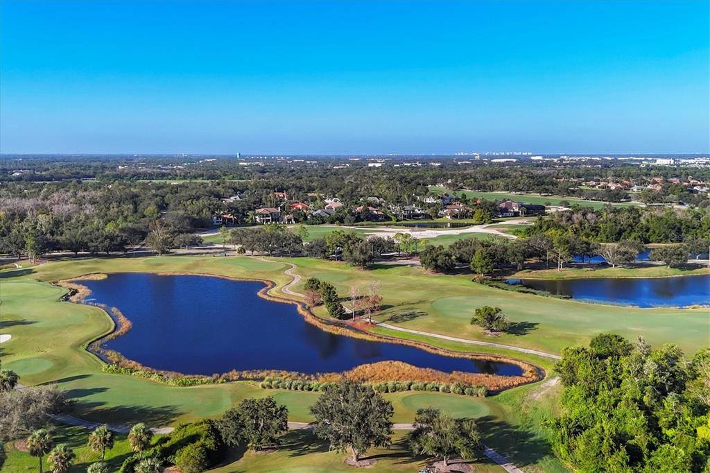 7815 Mathern Court Lakewood Ranch, FL 34202 - Photo 49 of 55 an aerial view of residential houses with outdoor space swimming pool and lake view