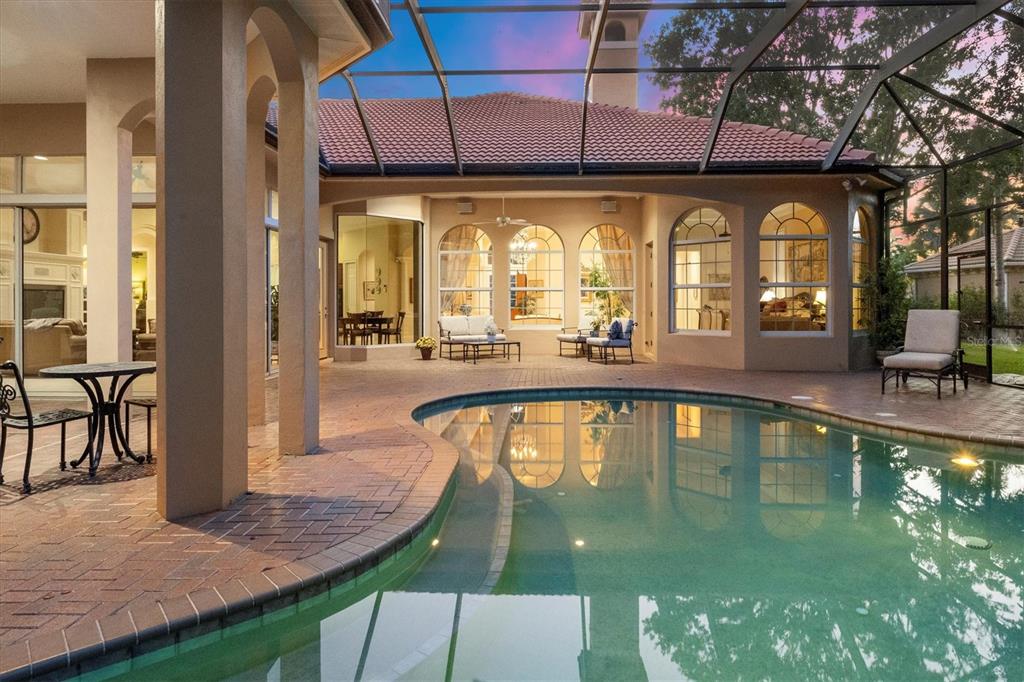 7815 Mathern Court Lakewood Ranch, FL 34202 - Photo 7 of 55 a view of a swimming pool with outdoor seating