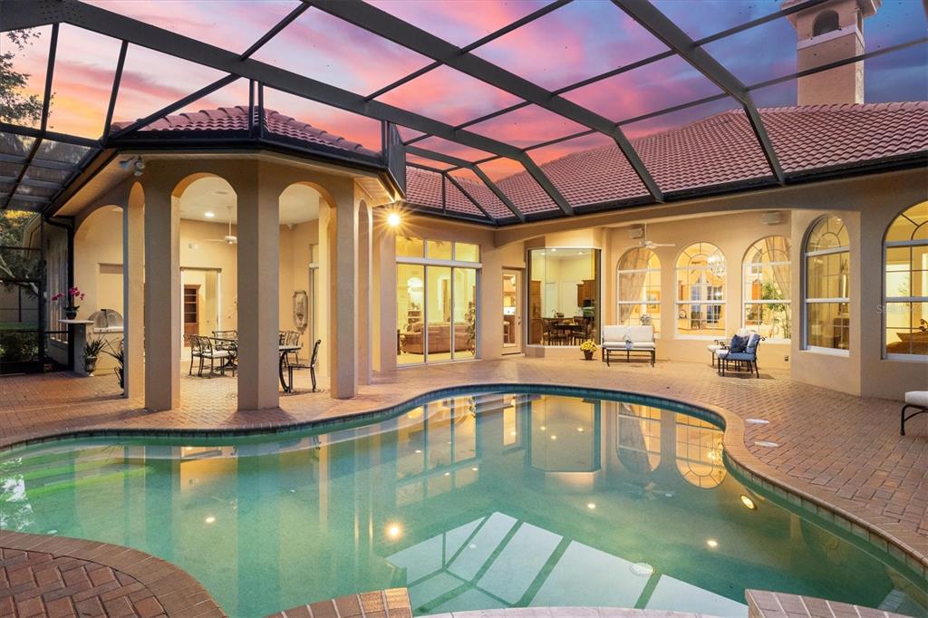 7815 Mathern Court Lakewood Ranch, FL 34202 - Photo 8 of 55 a swimming pool with outdoor seating