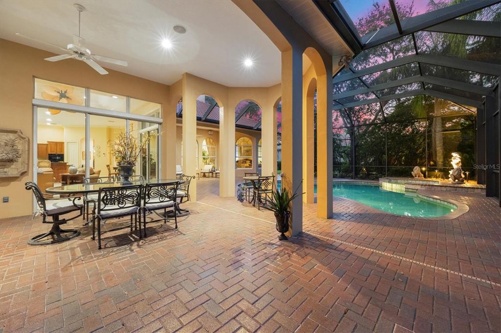 7815 Mathern Court Lakewood Ranch, FL 34202 - Photo 9 of 55 an outdoor space with lots of chairs and mirrors