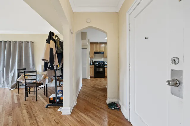 a view of hallway with wooden floor and stairs