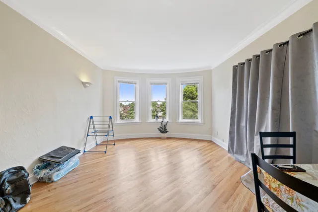 a view of a livingroom with wooden floor