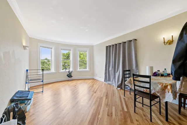 a view of a livingroom with furniture and a window