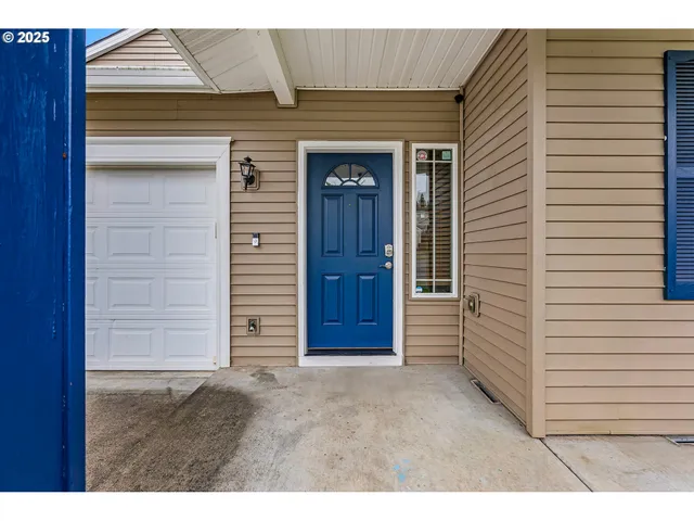 a bathroom with a sink vanity granite toilet and a mirror