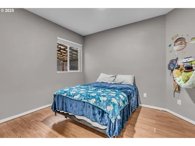 a bedroom with a bed and a table