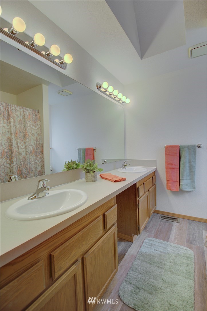 1820 Diamond Loop Southeast Lacey, WA 98503 - Photo 13 of 17 a bathroom with a sink double vanity and a mirror