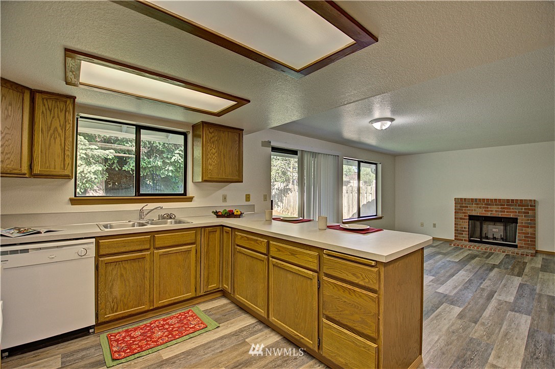 1820 Diamond Loop Southeast Lacey, WA 98503 - Photo 8 of 17 a kitchen that has a sink and a stove in it