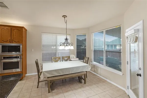 a dining room with furniture and window