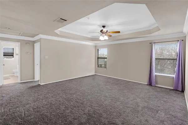 a view of an empty room with a window