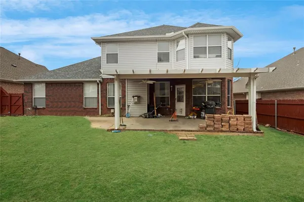a front view of a house with a yard and porch