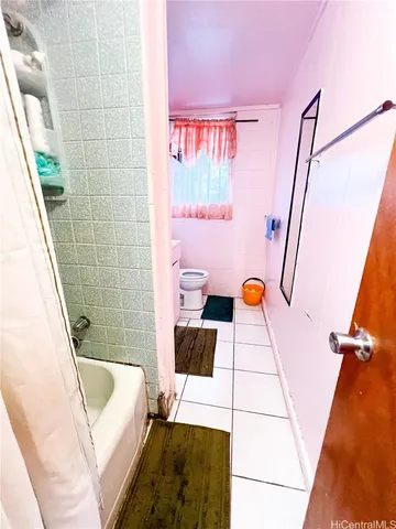 a bathroom with a tub and sink