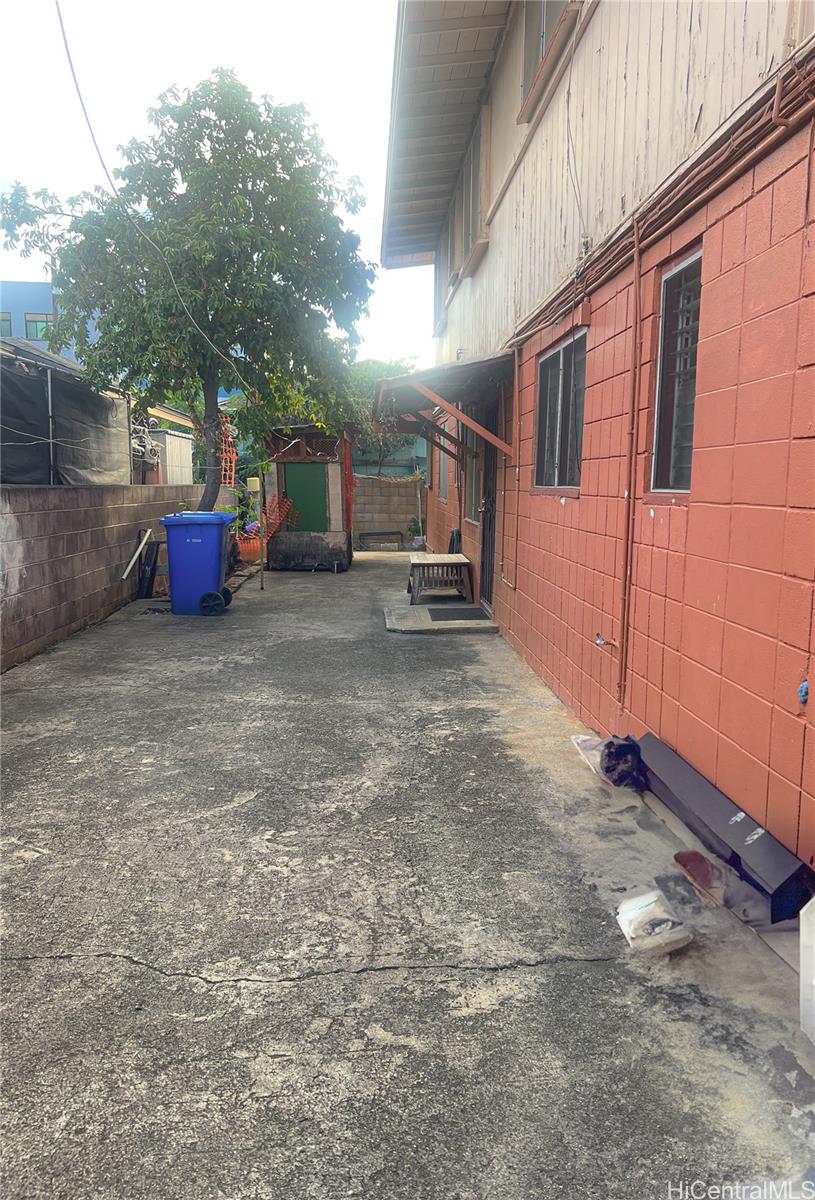 1815 Eluwene Street Honolulu, HI 96819 - Photo 10 of 11 a view of a house with a yard