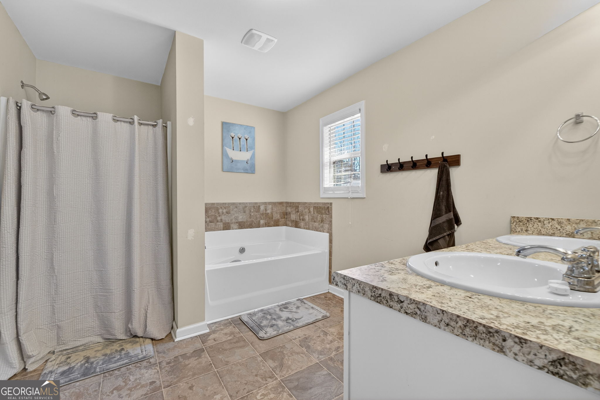 482 Louise Way Locust Grove, GA 30248 - Photo 16 of 29 a bathroom with a granite countertop sink and a bathtub