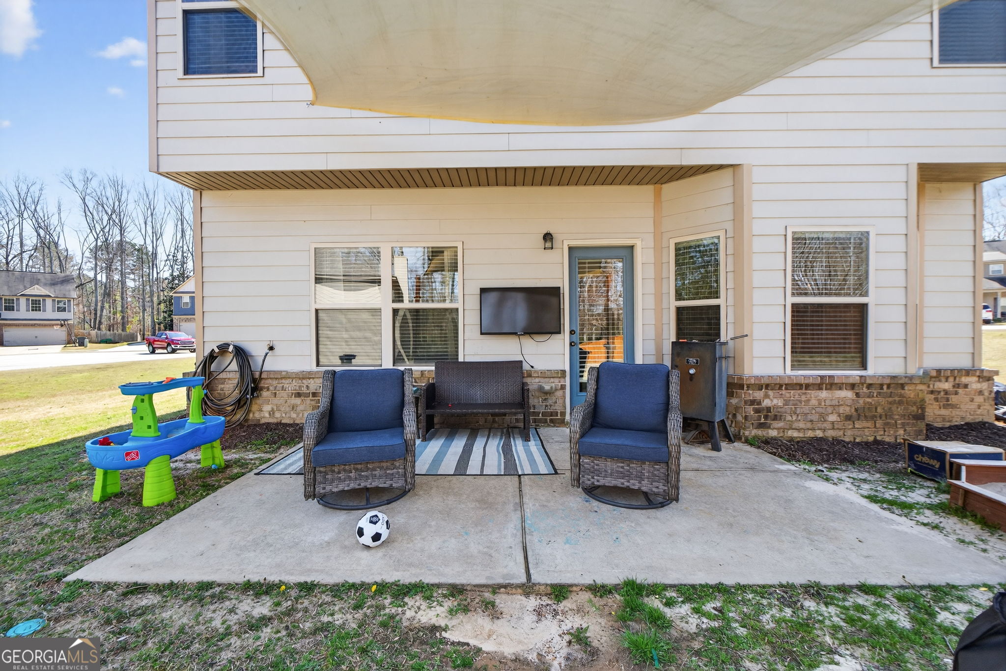 482 Louise Way Locust Grove, GA 30248 - Photo 24 of 29 a backyard of a house with outdoor seating