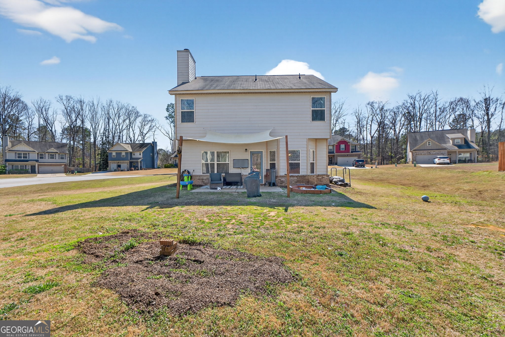 482 Louise Way Locust Grove, GA 30248 - Photo 25 of 29 a view of a house with a yard and sitting area