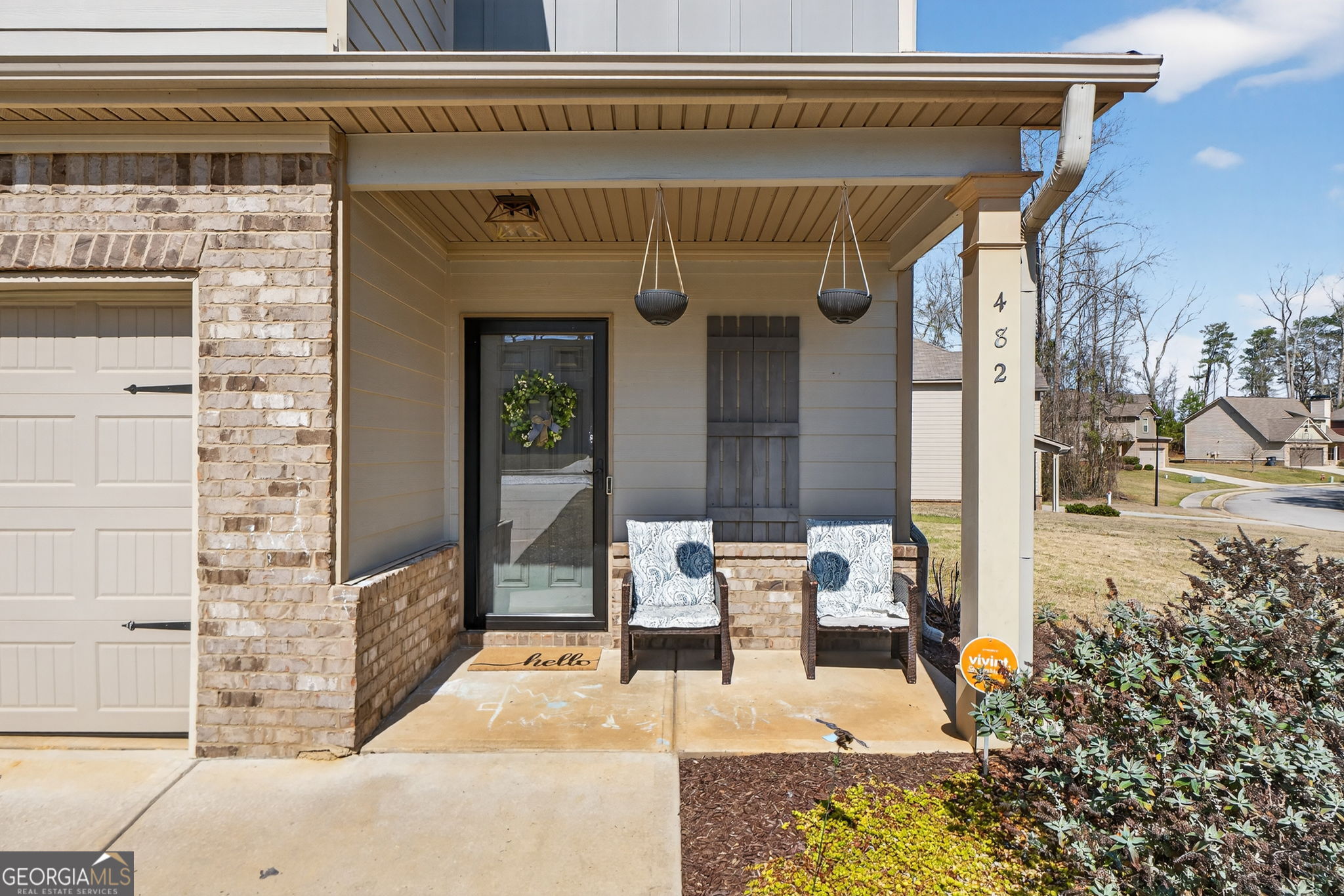 482 Louise Way Locust Grove, GA 30248 - Photo 3 of 29 a front view of a house with outdoor seating
