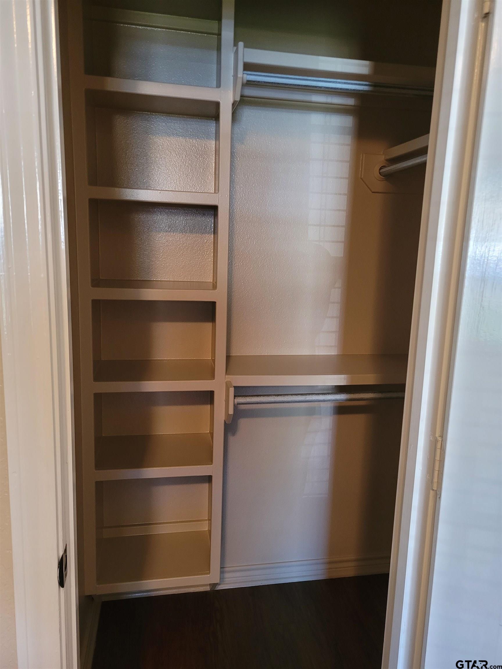 19054 County Road 1202 Flint, TX 75762 - Photo 11 of 19 a view of walk in closet with empty racks