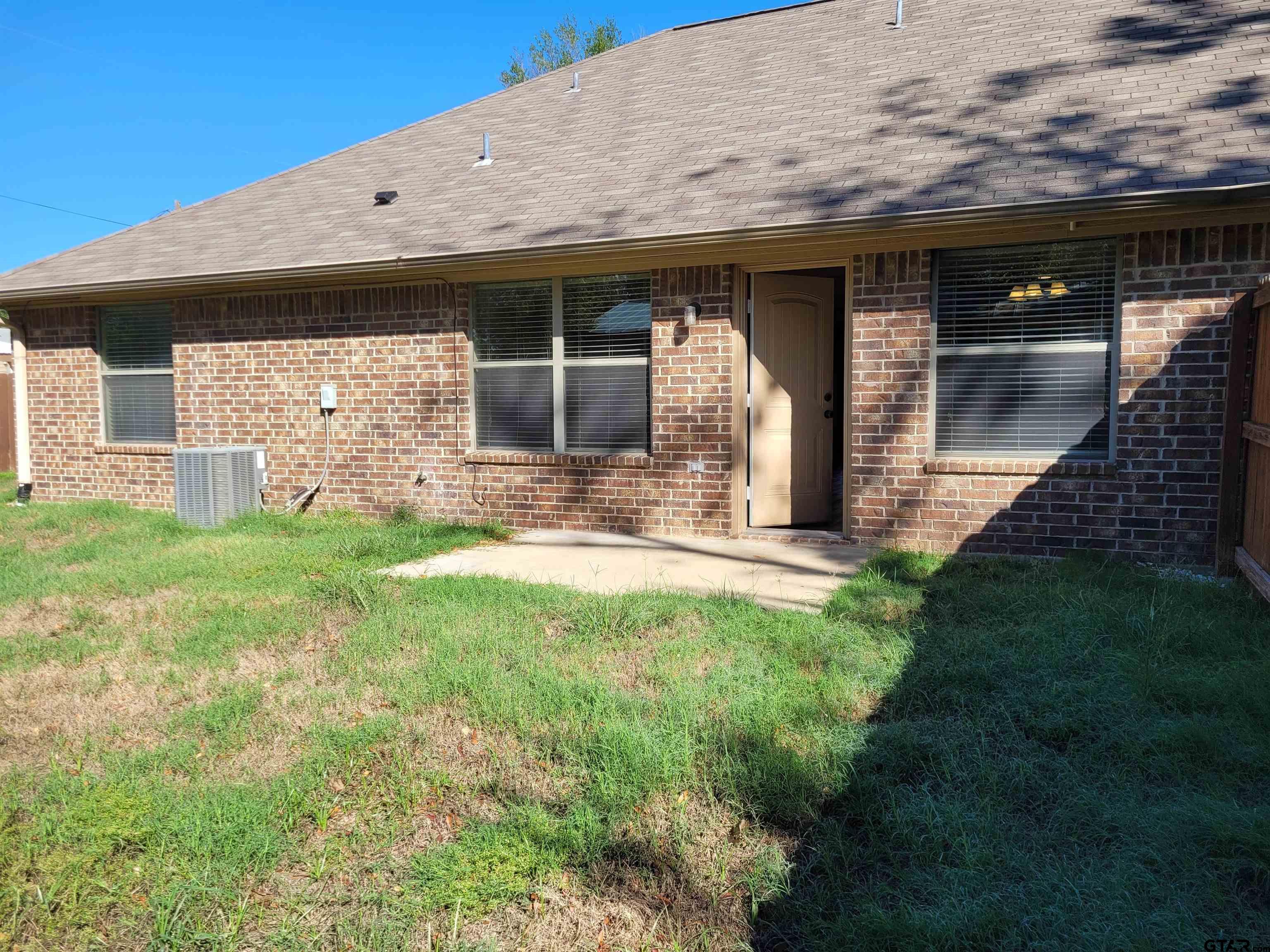 19054 County Road 1202 Flint, TX 75762 - Photo 17 of 19 a view of a house with backyard and porch