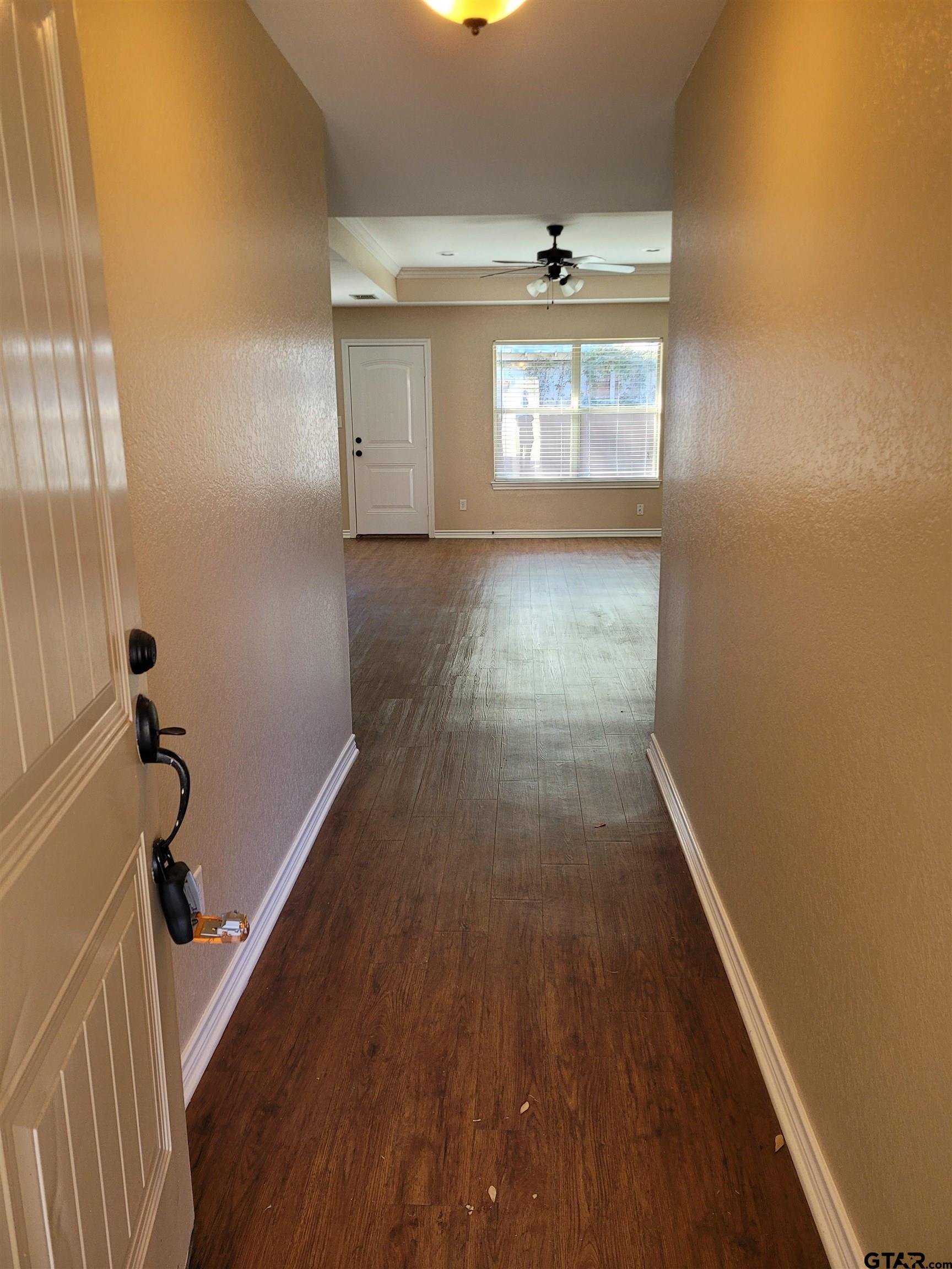 19054 County Road 1202 Flint, TX 75762 - Photo 3 of 19 a view of a room with wooden floor and staircase