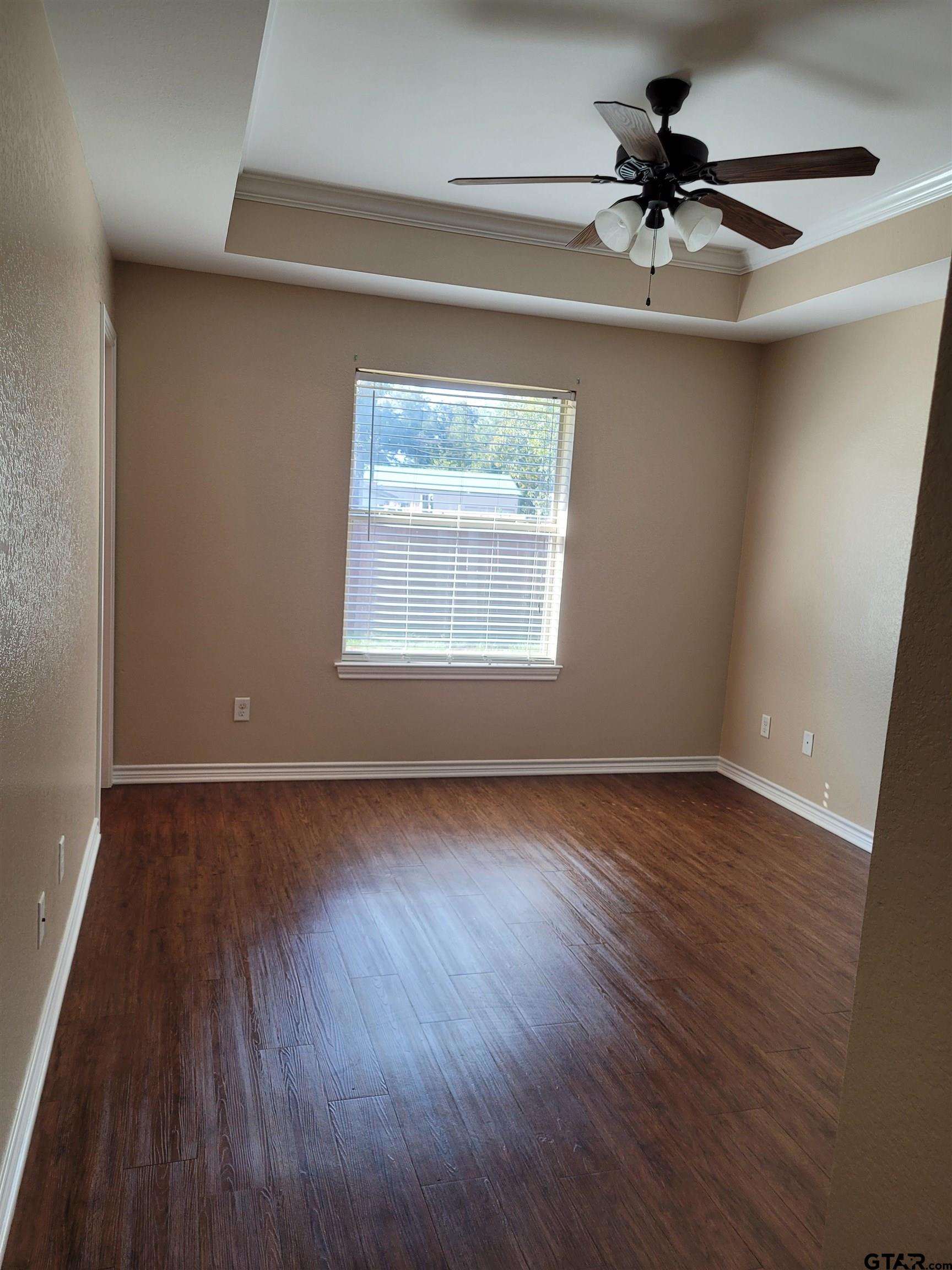 19054 County Road 1202 Flint, TX 75762 - Photo 10 of 19 a view of an empty room with wooden floor and a window
