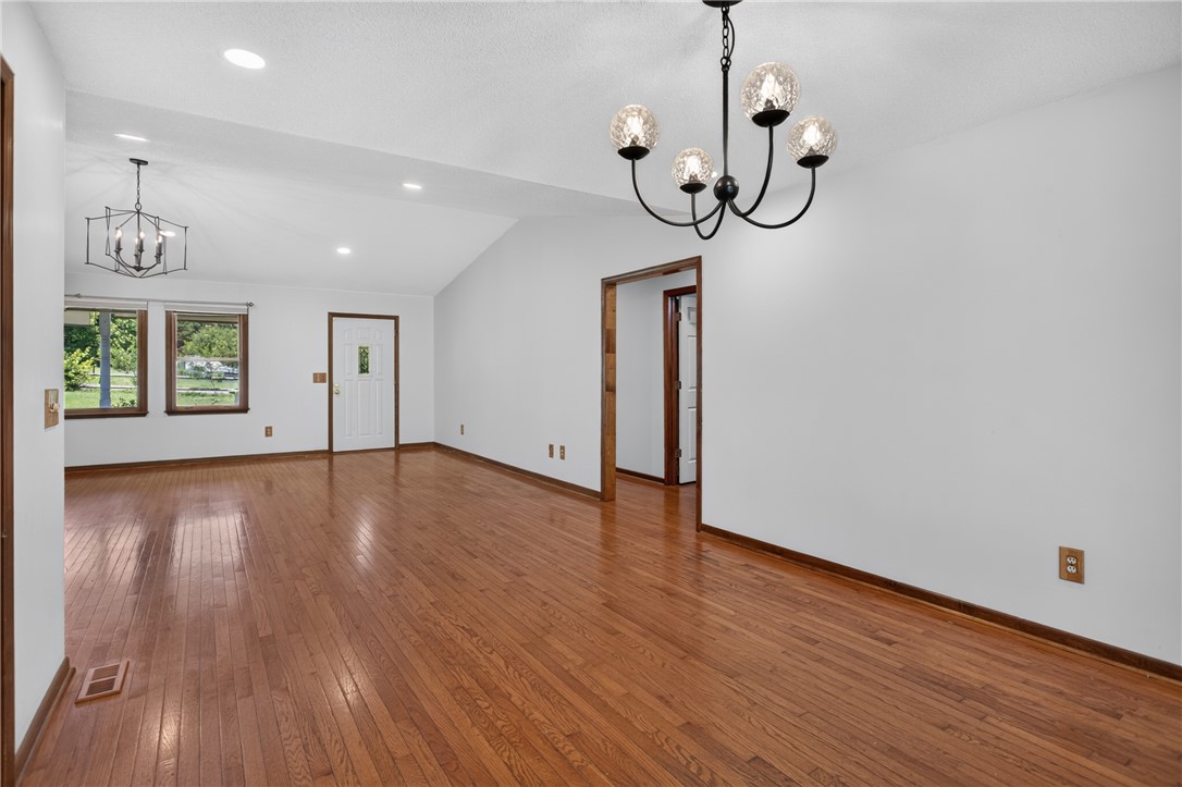 103 Dorsey Lane Walhalla, SC 29691 - Photo 5 of 42 Hardwood flooring extends throughout this generous living space, illuminated by recessed lighting and a stylish chandelier.