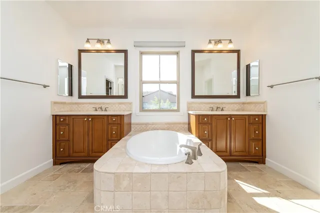a bathroom with a sink a vanity and mirror