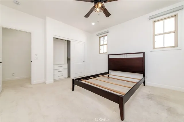 a living room with projector and a flat screen tv