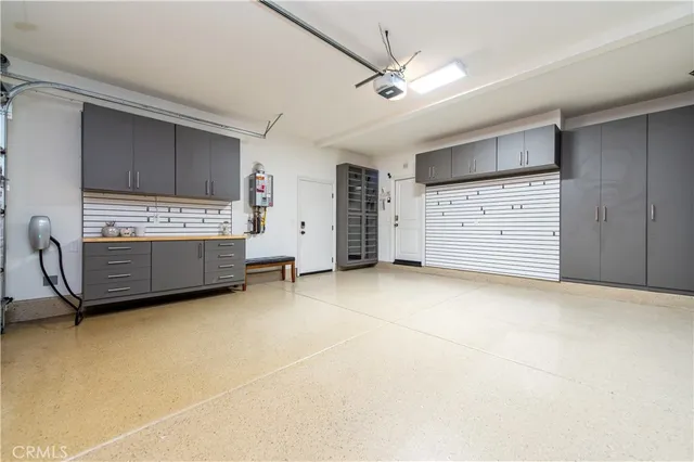 a view of an empty room with closet and cabinet