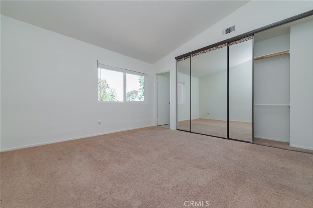 498 Monroe, Unit 15 Irvine, CA 92620 - Photo 11 of 26 an empty room with windows and closet