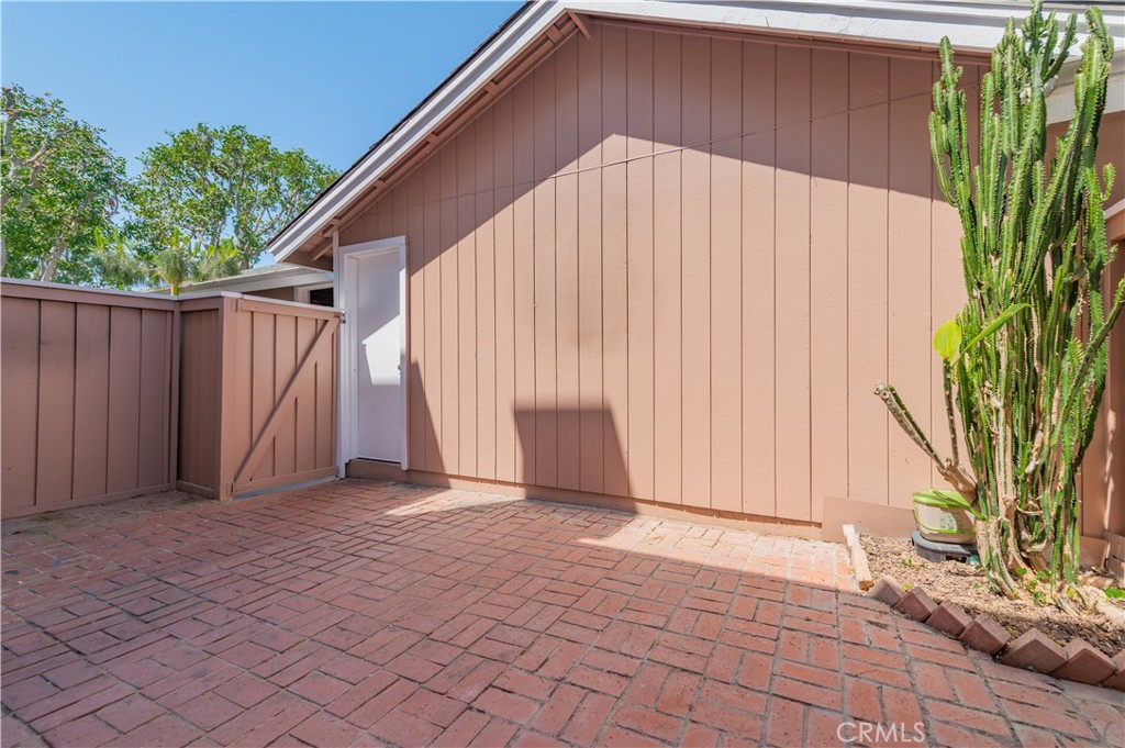 498 Monroe, Unit 15 Irvine, CA 92620 - Photo 16 of 26 a view of backyard with tub and trees