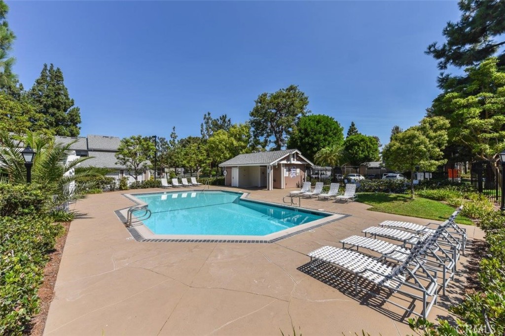 498 Monroe, Unit 15 Irvine, CA 92620 - Photo 19 of 26 a front view of a house with a yard