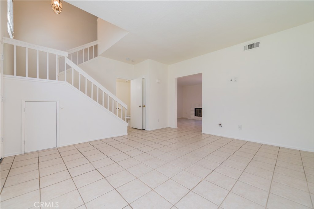 498 Monroe, Unit 15 Irvine, CA 92620 - Photo 3 of 26 a view of an empty room with stairs