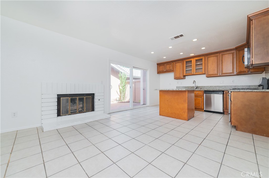 498 Monroe, Unit 15 Irvine, CA 92620 - Photo 5 of 26 an empty room with kitchen view and window