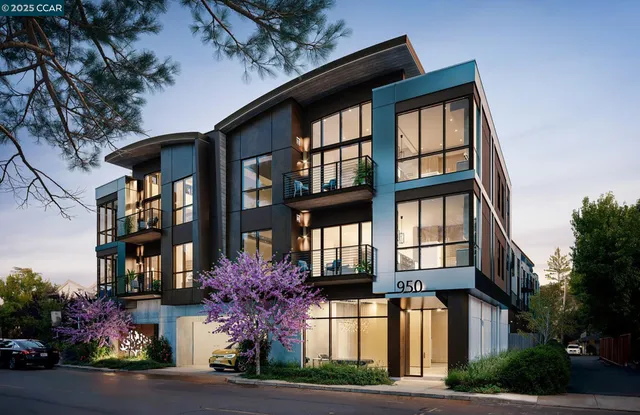 a front view of a multi story residential apartment building with yard and parking space