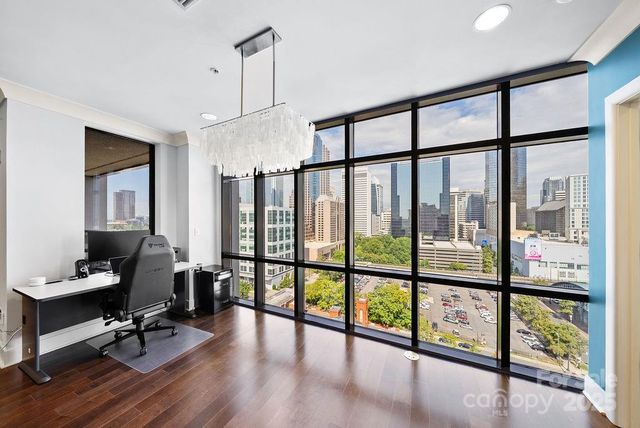 a view of workspace with large windows