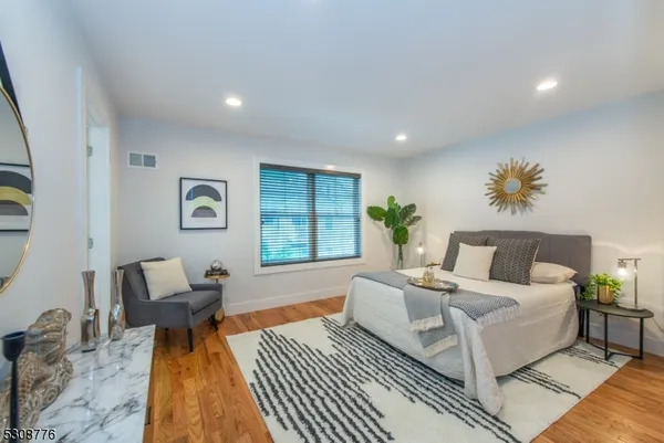 a living room with furniture and a rug