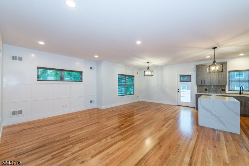360 Orange Road, Unit 1 Montclair, NJ 07042 - Photo 33 of 41 a view of kitchen and hall with wooden floor