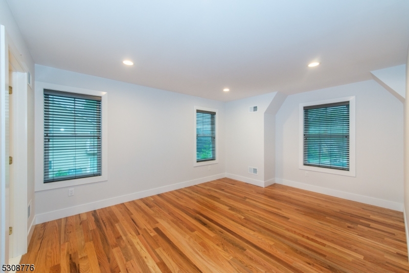 360 Orange Road, Unit 1 Montclair, NJ 07042 - Photo 36 of 41 a view of an empty room with wooden floor and a window