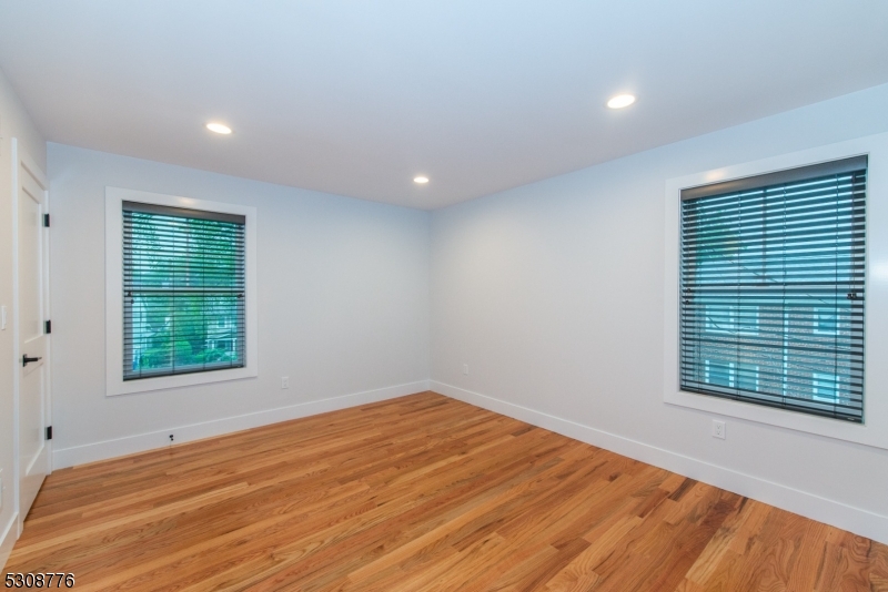 360 Orange Road, Unit 1 Montclair, NJ 07042 - Photo 38 of 41 a view of empty room with wooden floor and fan
