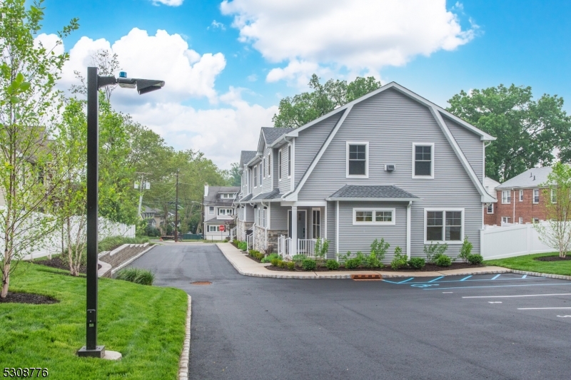 360 Orange Road, Unit 1 Montclair, NJ 07042 - Photo 39 of 41 a front view of a house with a garden and plants