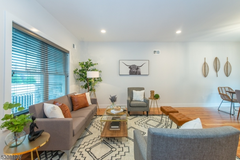 360 Orange Road, Unit 1 Montclair, NJ 07042 - Photo 7 of 41 a living room with furniture and a potted plant