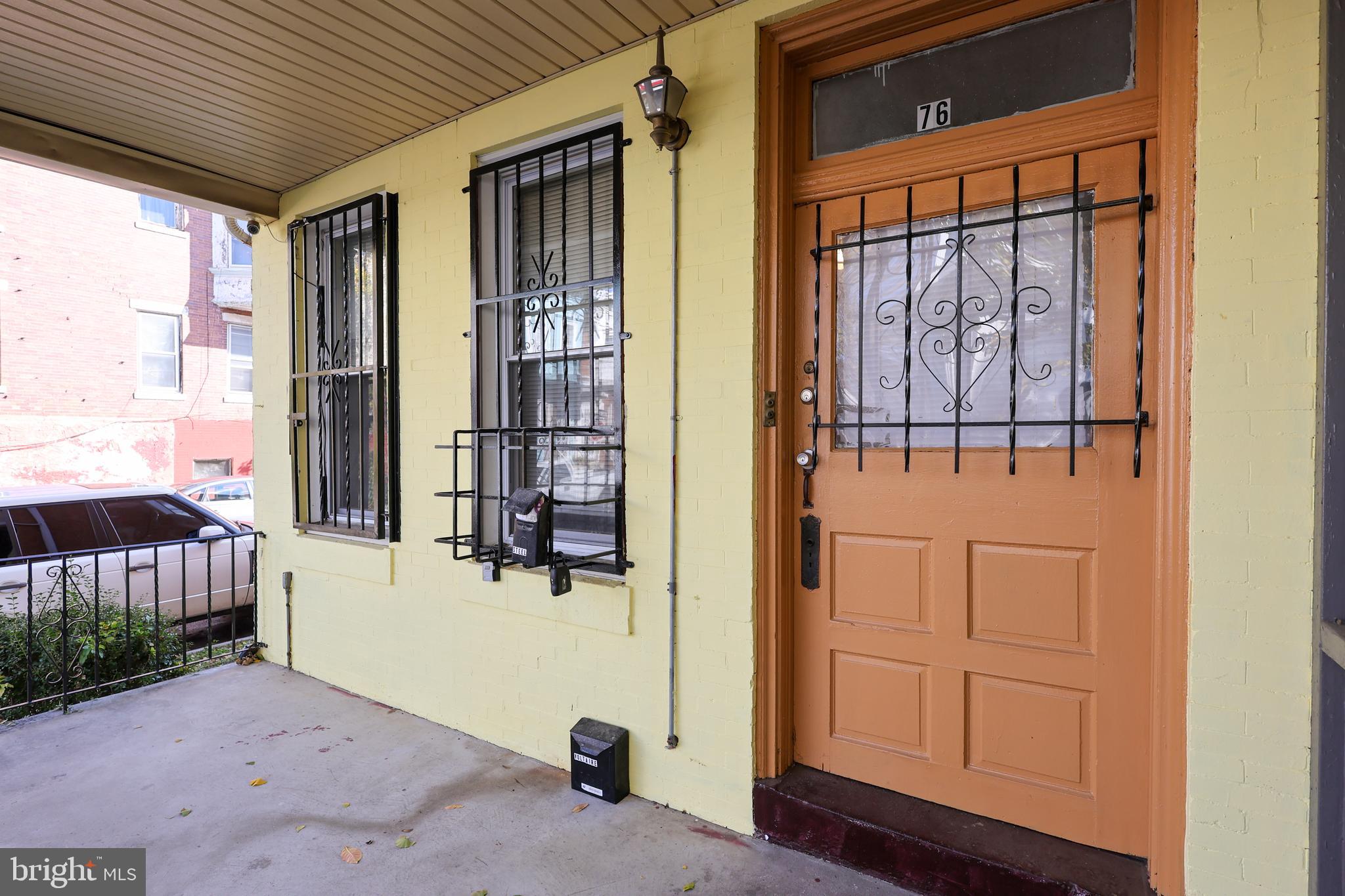 76 West Sharpnack Street Philadelphia, PA 19119 - Photo 2 of 14 a view of a porch with wooden floor and a window