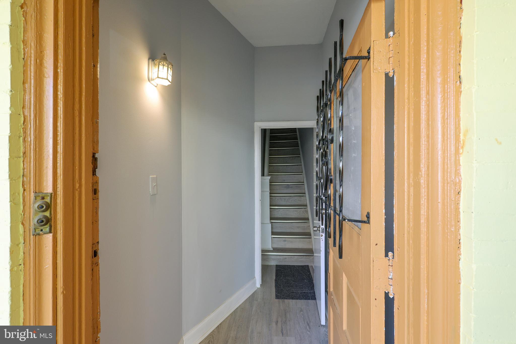 76 West Sharpnack Street Philadelphia, PA 19119 - Photo 3 of 14 a view of a hallway with wooden floor and windows