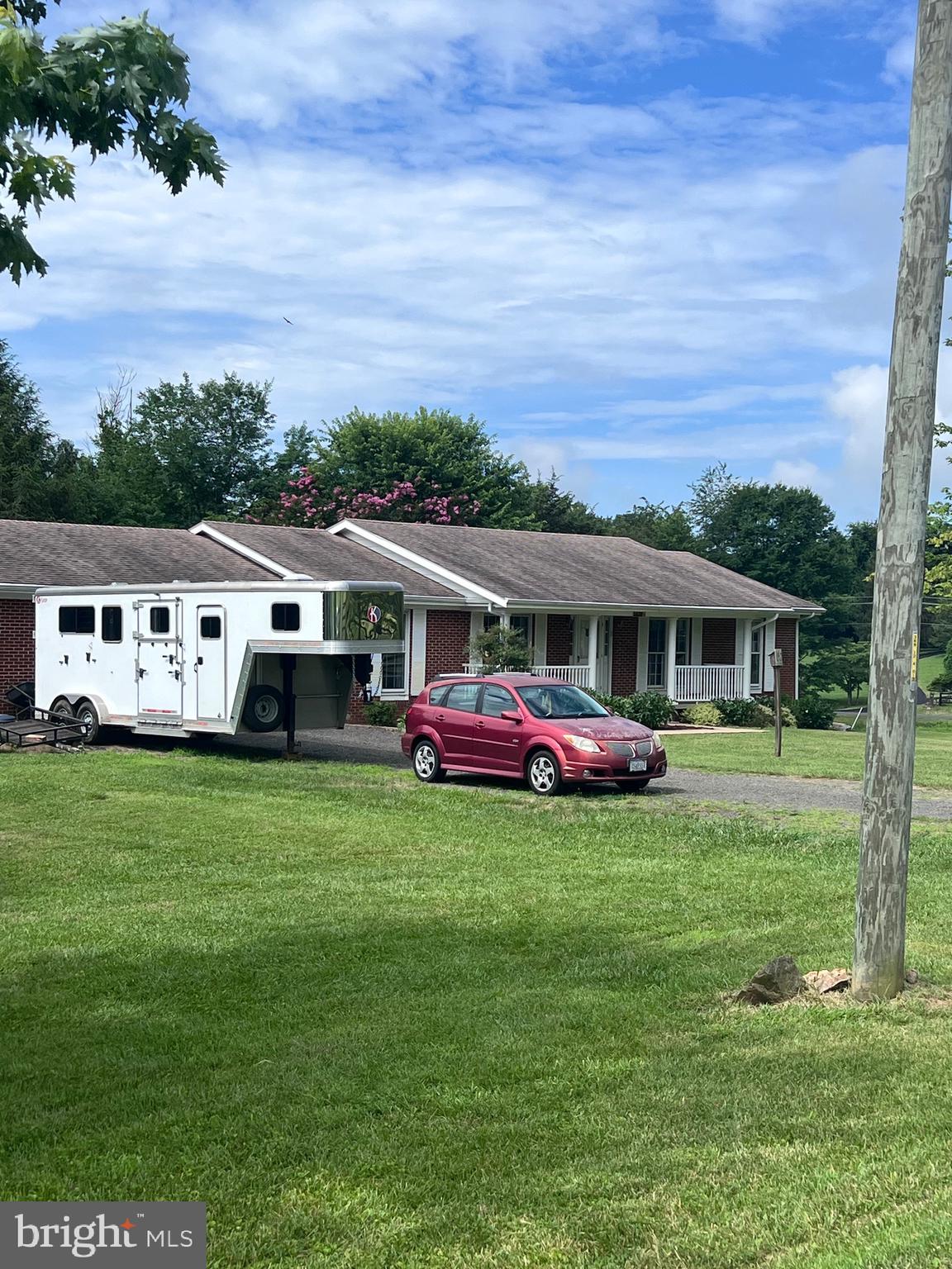 a front view of house with yard and trees