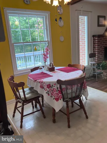 a dining room with furniture and window
