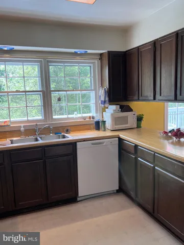 a kitchen with a sink and a window