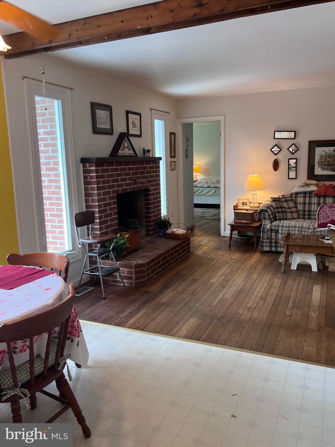 5377 Colt Drive Broad Run, VA 20137 - Photo 33 of 45 a living room with furniture a fireplace and a table